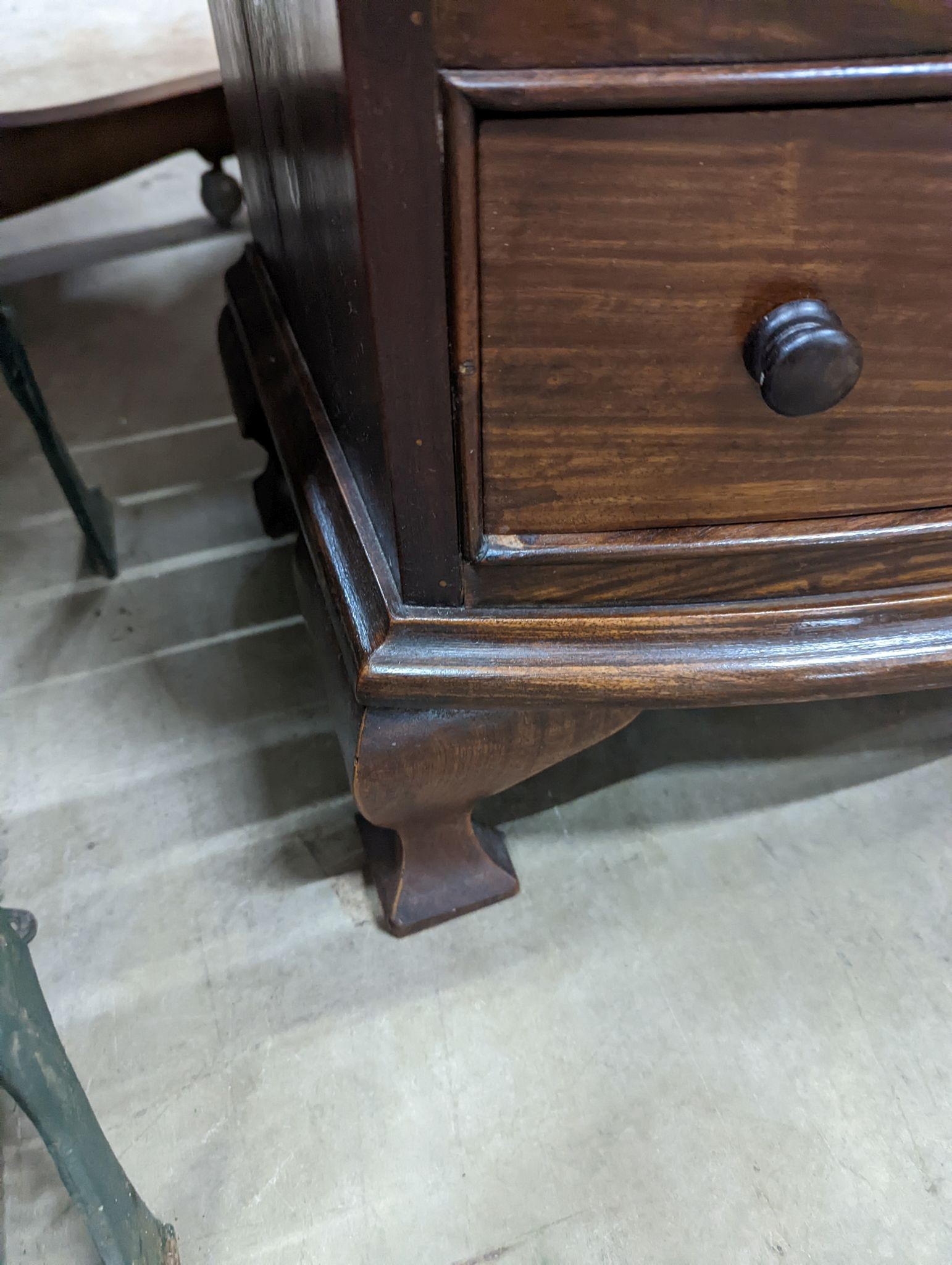 A small reproduction mahogany bow front chest of four long drawers, width 60cm, depth 38cm, height 82cm